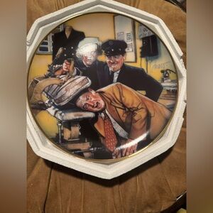 This is a Franklin Mint collector's plate featuring The Three Stooges.